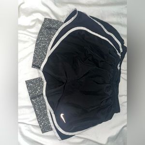 Black Nike shorts with a lining underneath